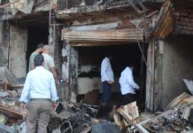 Fire destroyed business: Shops continued to smolder for the second day, shopkeepers kept searching for goods in the pile of ashes